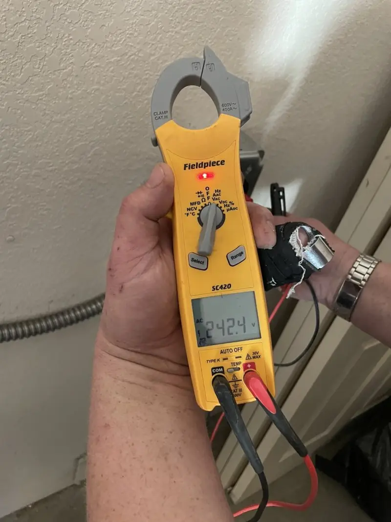 Voltage testing with clamp meter during Electrical Installation Services in Hot Springs